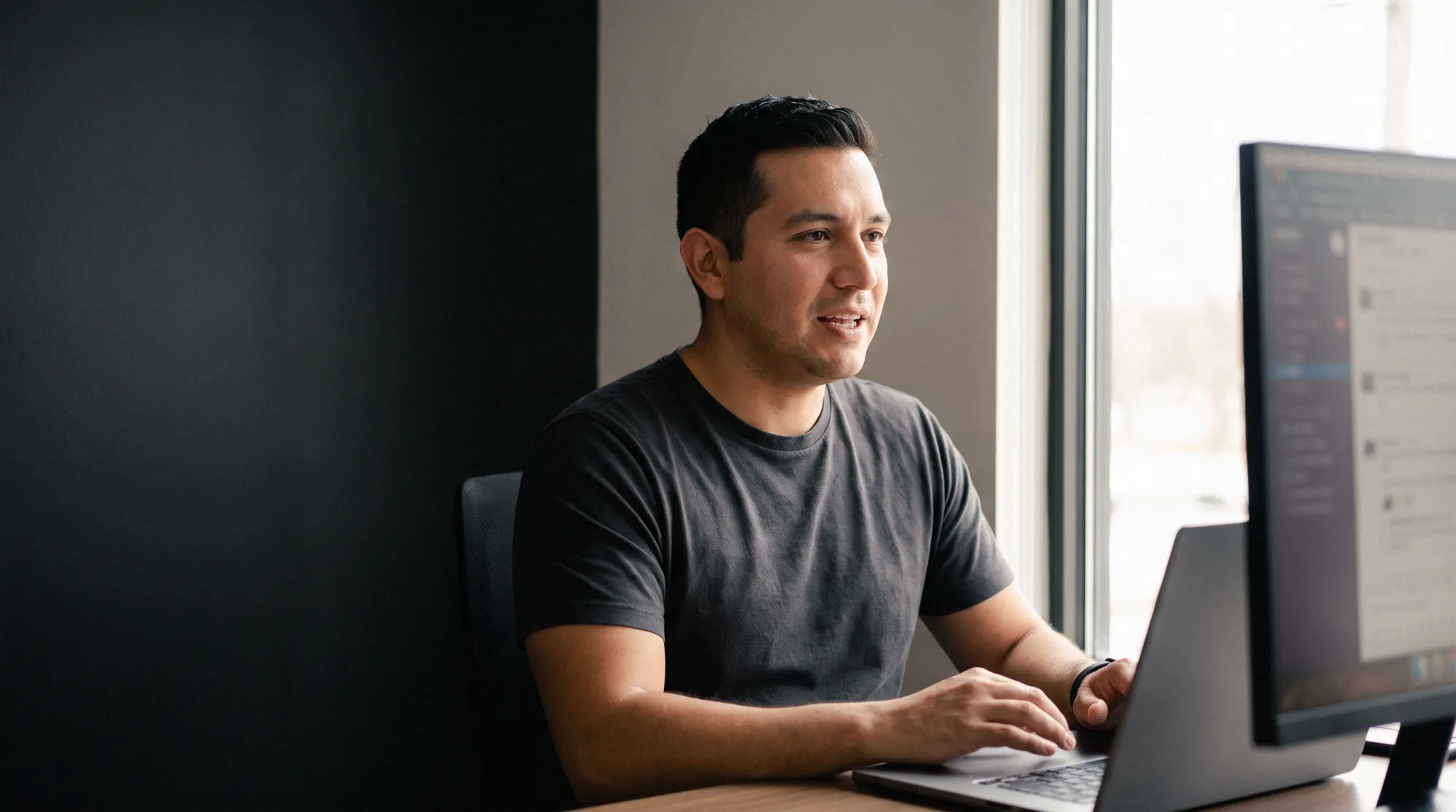 A recruiter on a call at a laptop